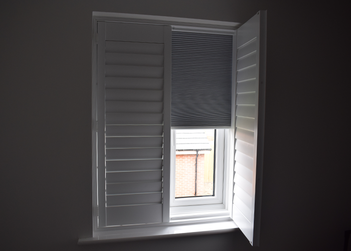 Blackout Shutters in a Child's Bedroom, showing one panel open with the pleated blind visible